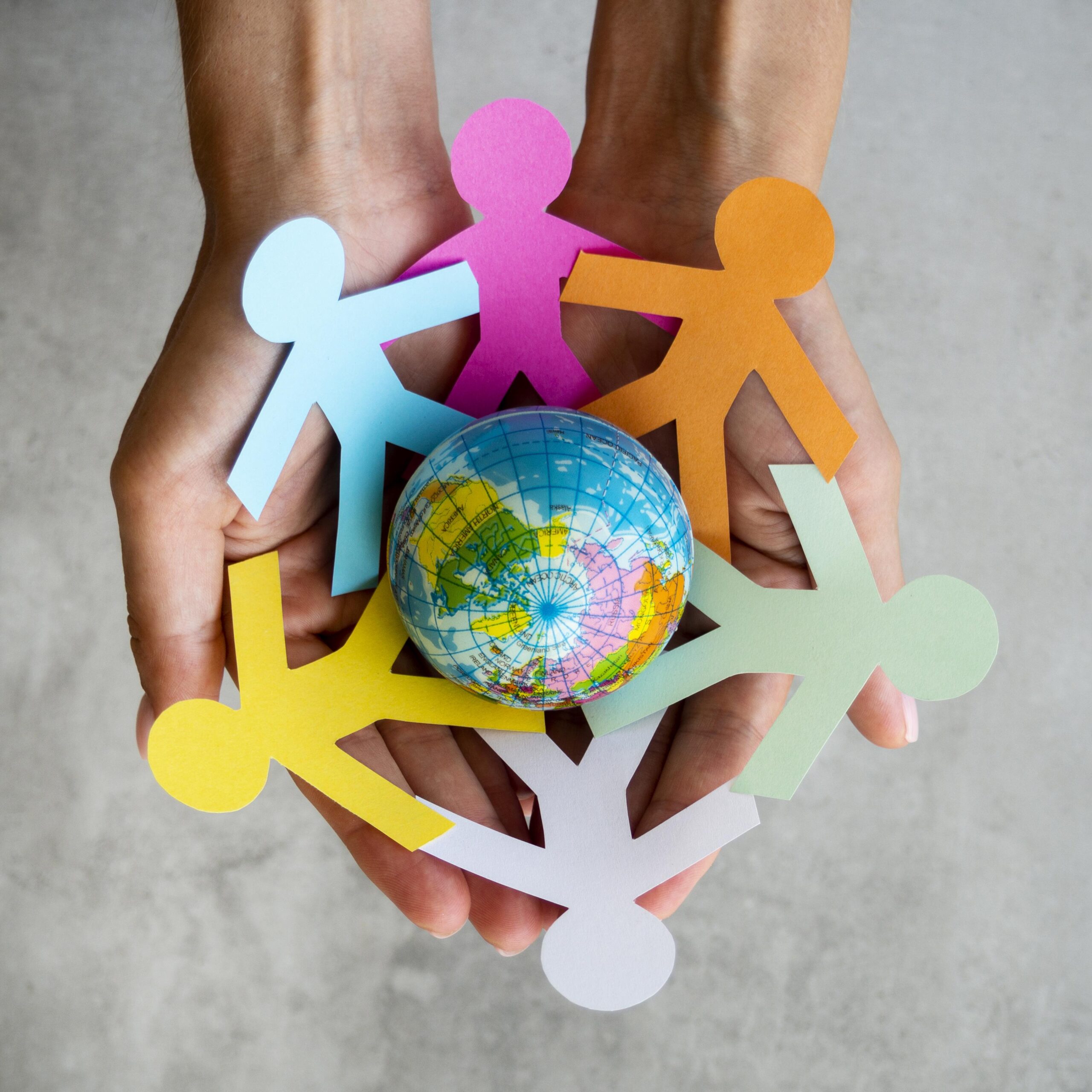 top view origami chain people with globe